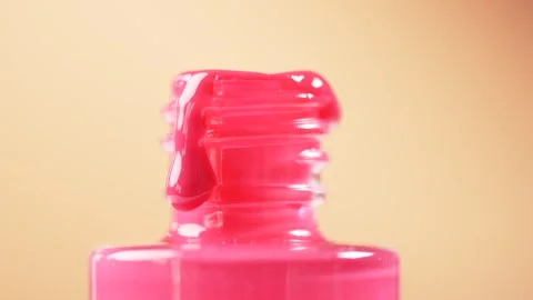 Nail polish dripping down the bottle, slow motion, macro. Stock Footage 305513107