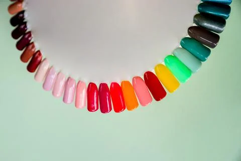 Nail polish samples in different bright colors. Colorful nail lacquer manicure Stock Photos