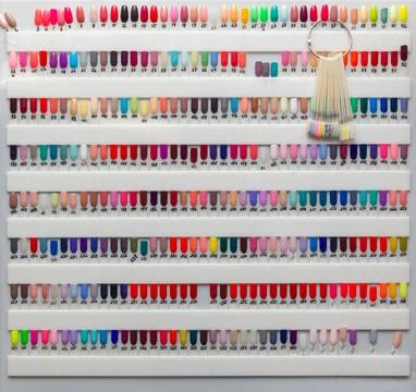 Nail polish samples of different bright colors on a white background. Stock Photos