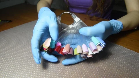 Nail polish samples in female hands. Nail polish testers and woman  hands. Stock Footage 121166510