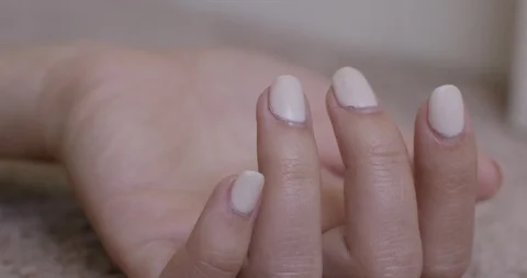 Nail-polished hands twitching Stock Footage 97927035