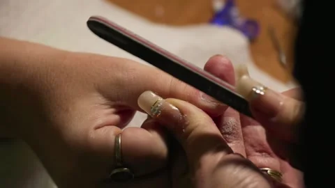 Nail Shaping with File at Salon Stock Footage 299976979