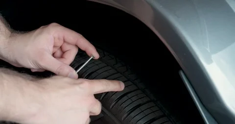 Nail Stuck in Car Tire Causing Puncture Stock Footage 344464078