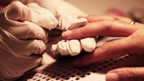Nail technician preparing fingernails for manicure Video stock 342313995