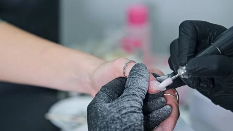 Nail technician using electric file during hardware manicure Stock-Footage 344348046