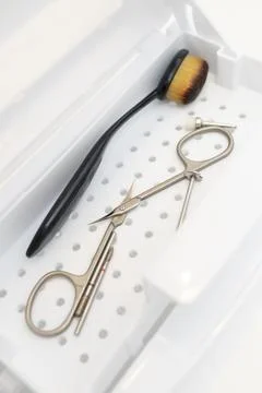 Nail tool sterilizer box, plastic sterilization tray, closeup sanitizing machine Stock Photos