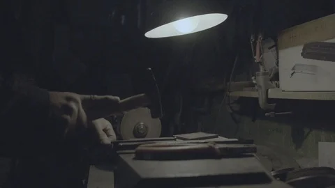 Nailing a nail with hammer in workshop Stock Footage 89613792