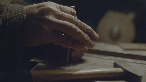 Nailing a nail with hammer in workshop Stock Footage 89614053