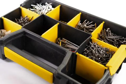 Nails and a case for construction tools. Stock Photos