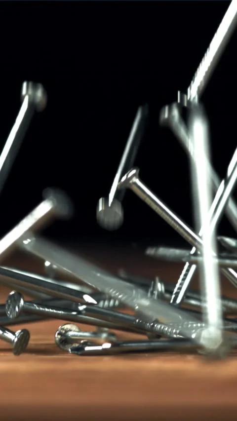 Nails fall on the carpenter's worktable. Filmed on a high-speed camera at 1000 Stock Footage 335365129