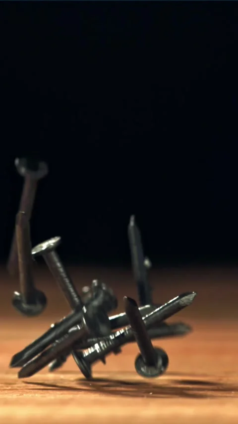 Nails fall on the carpenter's worktable. Filmed on a high-speed camera at 1000 Stock Footage 335365177