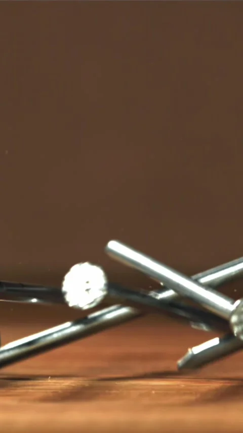 Nails fall on the carpenter's worktable. Filmed on a high-speed camera at 1000 Stock Footage 335366545