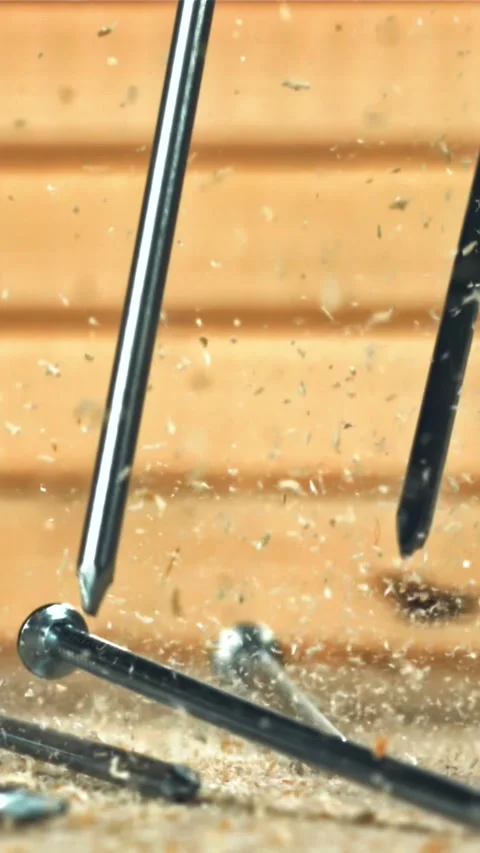 The nails fall on the master's desk. Filmed on a high-speed camera at 1000 fps Stock Footage 335364413
