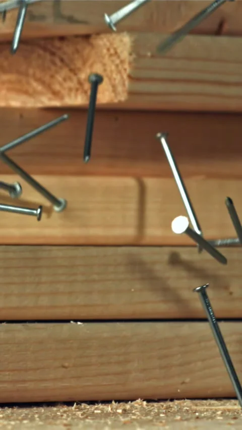 The nails fall on the master's desk. Filmed on a high-speed camera at 1000 fps Stock Footage 335364606