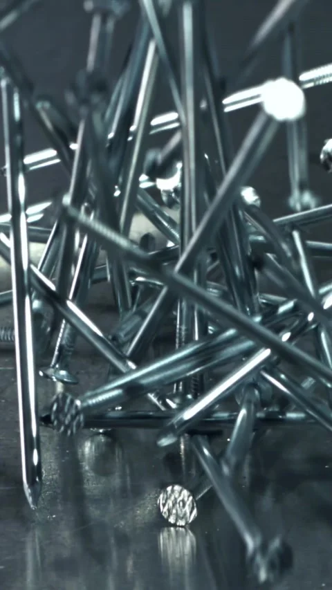 Nails fall on a metal table. Filmed on a high-speed camera at 1000 fps Stock Footage 335366135