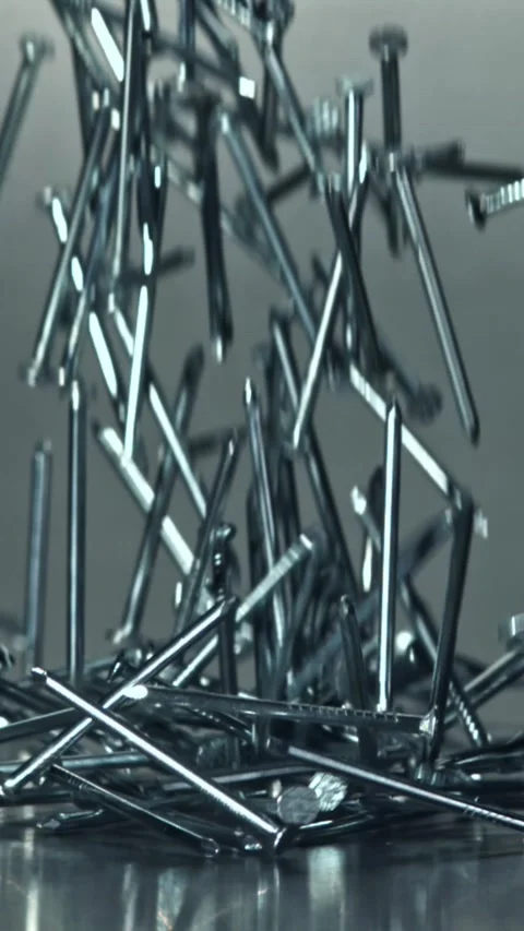 Nails fall on a metal table. Filmed on a high-speed camera at 1000 fps Stock Footage 335367673