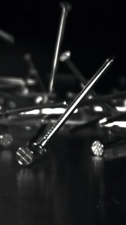 Nails fall on a metal table. Filmed on a high-speed camera at 1000 fps Stock Footage 335371779