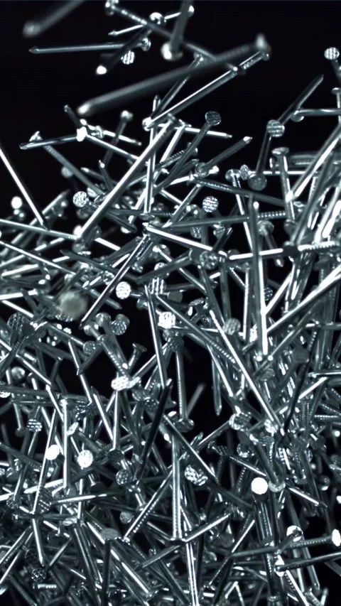 The nails fly up and fall down. Filmed on a high-speed camera at 1000 fps Stock Footage 335372137