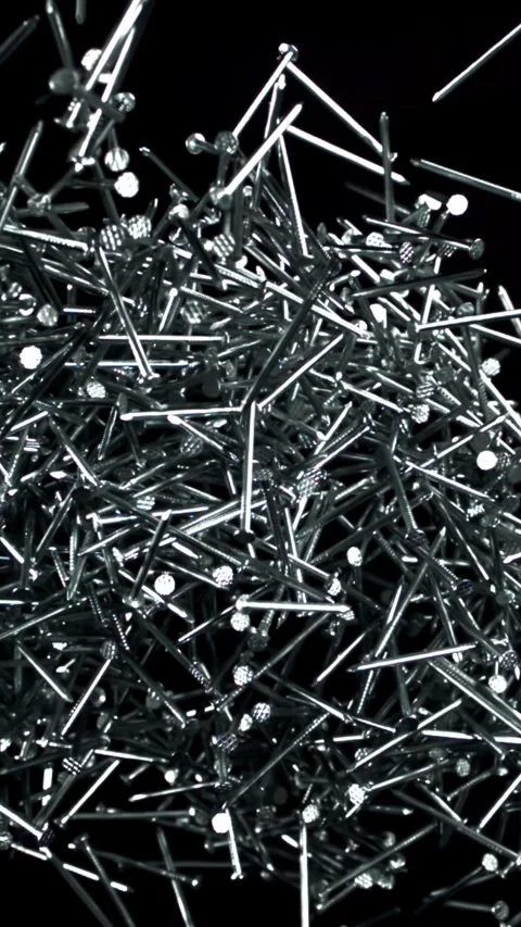 The nails fly up and fall down. Filmed on a high-speed camera at 1000 fps Stock Footage 335373699