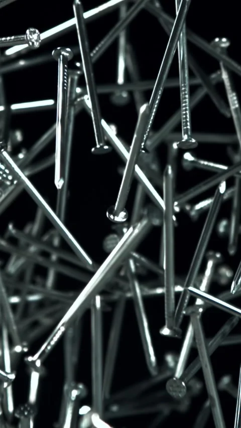 The nails fly up and fall down. Filmed on a high-speed camera at 1000 fps Stock Footage 335379422