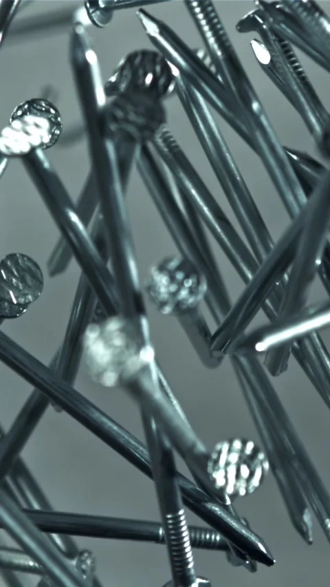 The nails fly up and fall down. Filmed on a high-speed camera at 1000 fps Stock Footage 335380190
