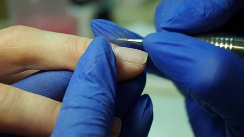 Nails manicure closeup, milling and drilling 動画素材 80787992