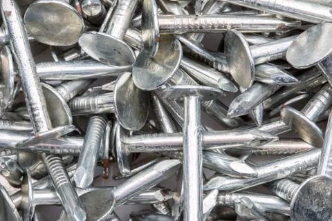 Nails in a pile for use as a background. Stock Photos