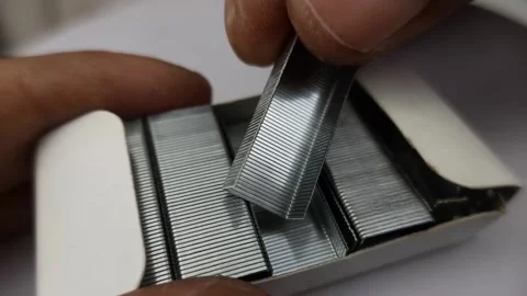Nails from staples in paper box Stock Footage 276319894