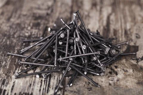 Nails on a wooden background Stock Photos