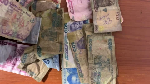 Naira on the table stashed Stock Footage 261128518