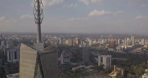 Nairobi City - Aerial pull back from city revealing close up Britam Tower Stock Footage 147693029