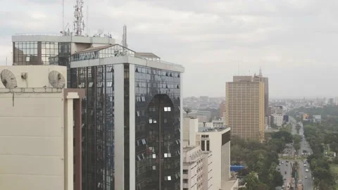 Nairobi, Close up dolly shot tracking city buildings with reflections Video stock 147793630