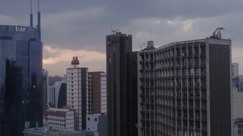Nairobi, Evening pull back and boom up revealing more city buildings Video stock 147832150