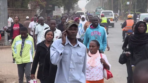 NAIROBI, KENYA - SEPTEMBER 2019: A crowd of people walking on the streets as th Stock Footage