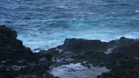 Nakalele blowhole on north coast of Maui by rough ocean Stock Footage