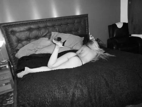 Naked in bed Foto stock