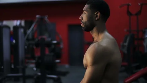 Naked black man is preparing for training in the gym. Stock Footage 101338177