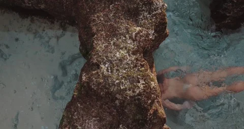 Naked woman with perfect body swimming in natural pool Видео 255280188