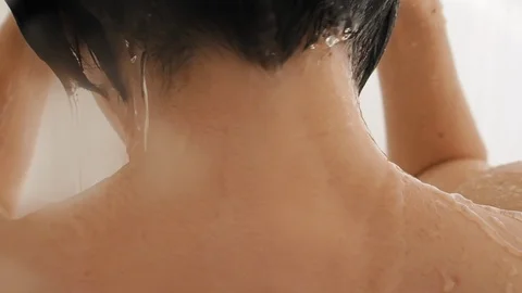 Naked woman takes a shower. Woman washes... | Stock Video