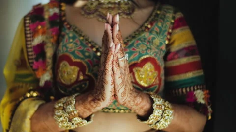 Namaste sign. Joined palms of an Indian bride close up. Indian Bride's outfit Stock Footage 240319853