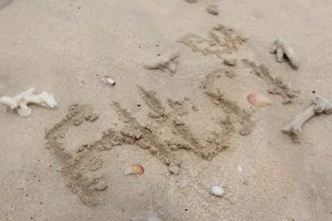 Name in beach with shellfish Stock Photos