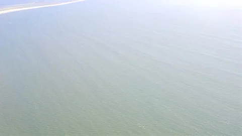 Namib Desert Meets Atlantic Ocean Aerial Shot: Sandwich Harbour 4K 60p Stockbeeldmateriaal 339070282