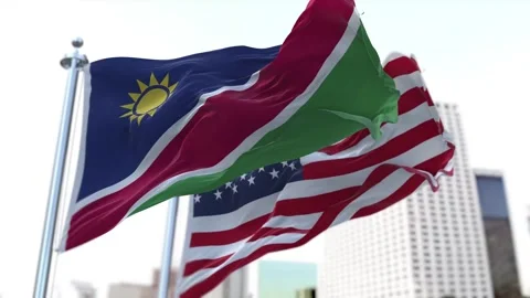 Namibia and United States Flags Waving on Flagpoles. Seamless Stock Footage 297387824