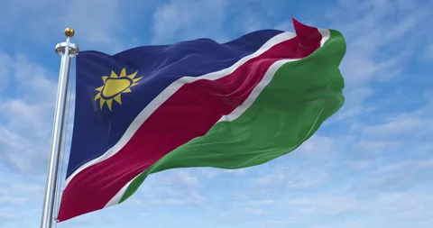 Namibia flag with flagpole waving in rolling clouds looping, 4K Perfect Loop 库存影片 280705084