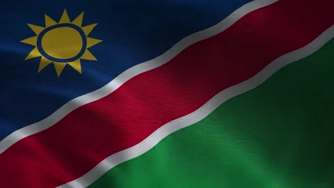 Namibia flag waving closeup with sun emblem, red blue green diagonal stripes, s Vídeos de archivo 339547805