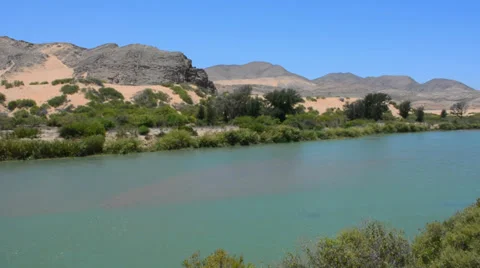 Namibia Namibia Angola Kunene River Serra Cafema Camp border with sand dunes and Stock-Footage 37213380