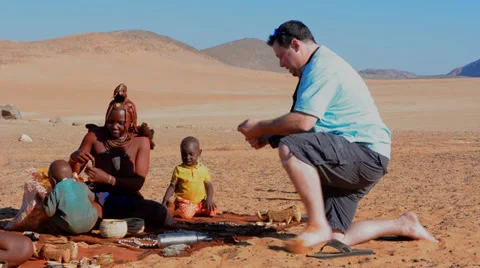 Namibia Namibia remote nomadic Himba tribe young woman with child selling Vídeos de archivo 37213394