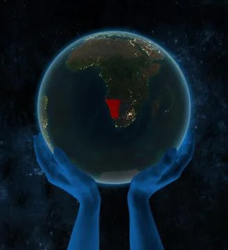 Namibia on night Earth in hands in space Stock Illustration