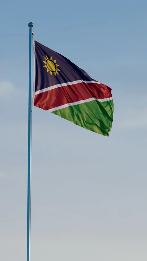 Namibia, Windhoek: Cinematic Vertical Waving National Flag Against Blue Sky Stock Footage 322177654