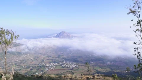 Nandi hills at distant horizon surrounded by clouds 動画素材 90933601